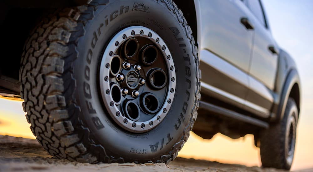 A close-up shot of a wheel on a grey 2024 Ford F-150 Raptor.