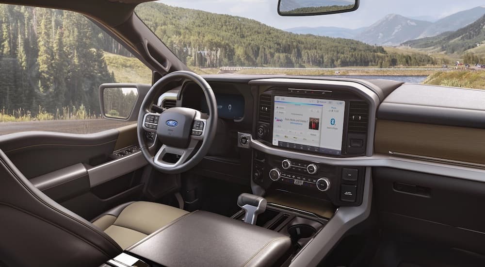 The black and brown interior of a 2024 Ford F-150 XLT.