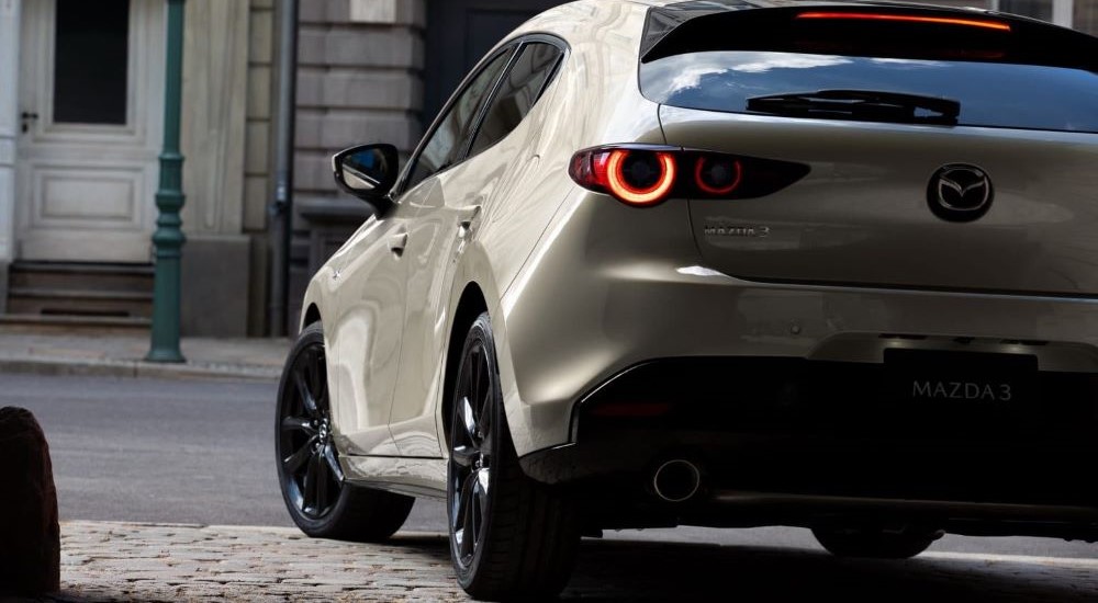 Rear view of a silver 2023 Mazda3 hatchback.