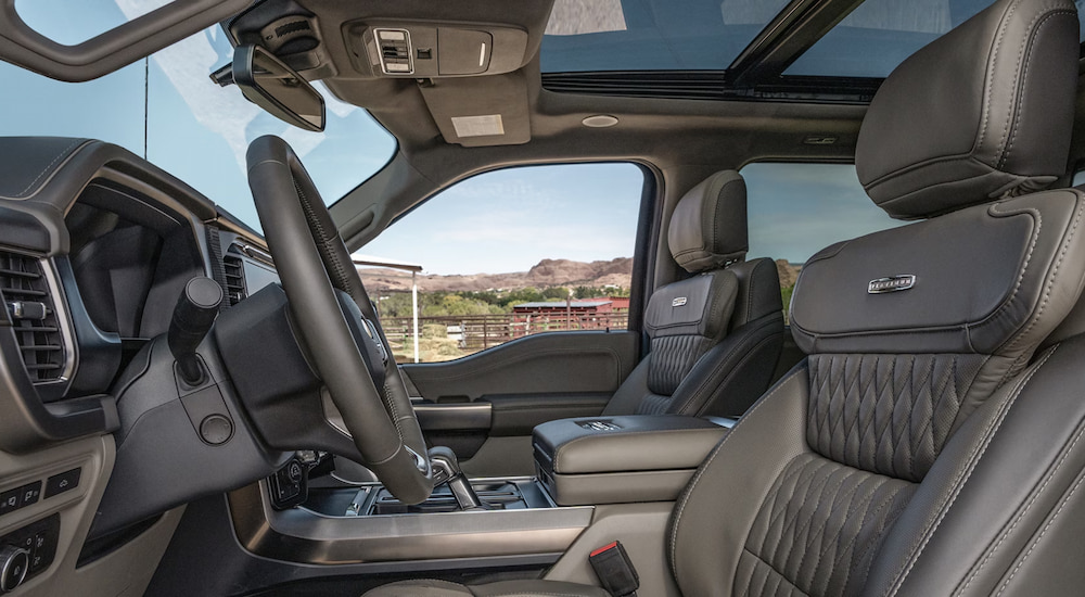 The front seats in a 2024 Ford F-150 Platinum at a Ford dealer near El Paso.